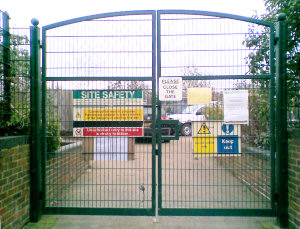 Gates at the corner of Wharf Lane and the service road